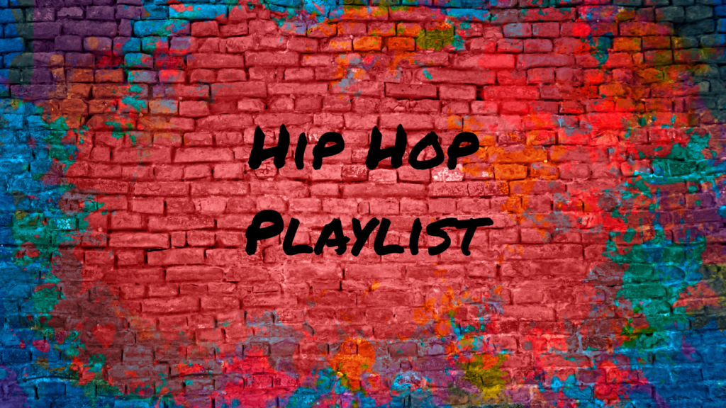 Red painted brick wall with message "Hip Hop Playlist" spray painted on the wall