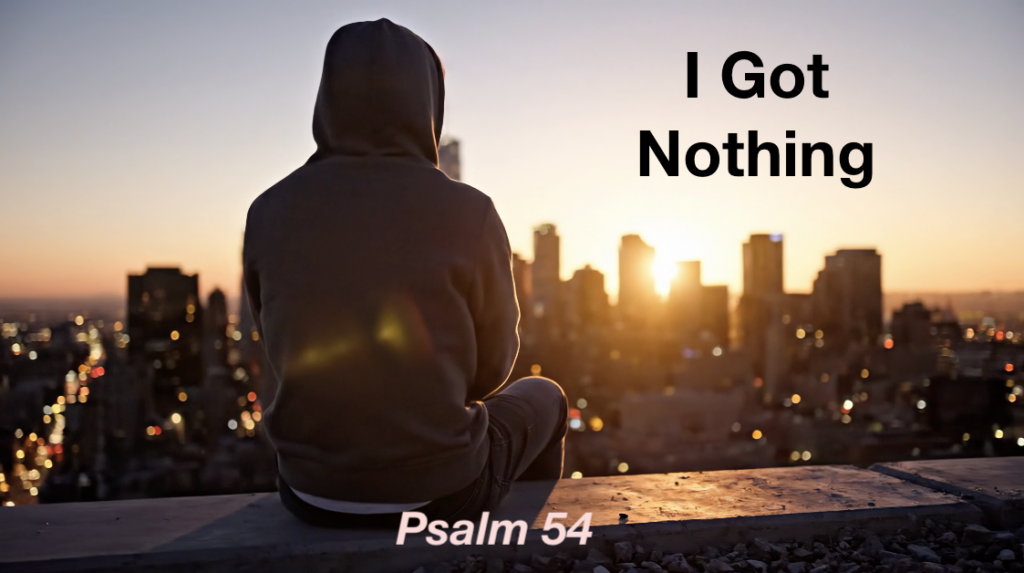 Person sitting on rooftop looking out over city with the text "I Got Nothing - Psalm 54"
