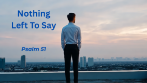 A man standing on a rooftop looking out over a city with the text "Nothing Left To Say - Psalm 51"